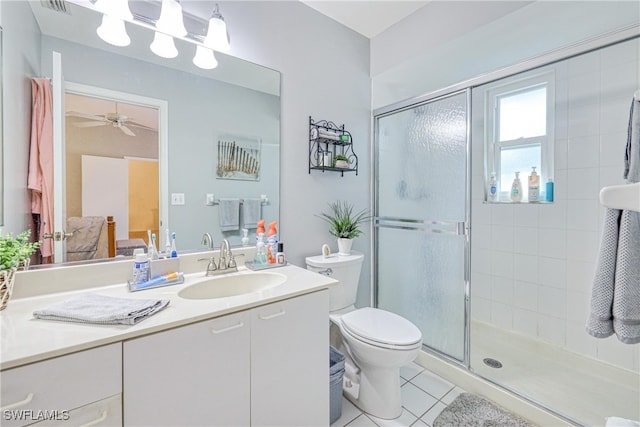 bathroom with vanity, an enclosed shower, tile patterned flooring, and toilet