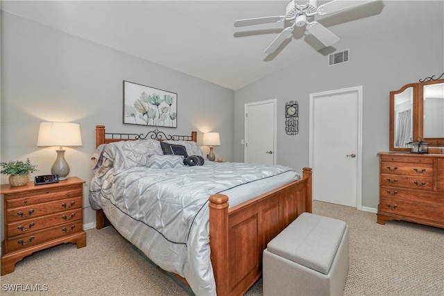 bedroom featuring light carpet, vaulted ceiling, and ceiling fan