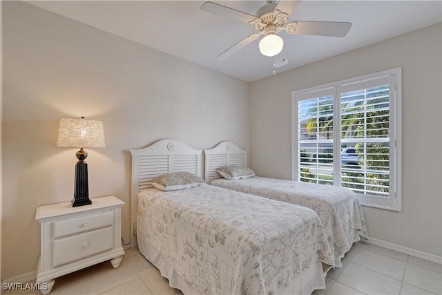 bedroom featuring light tile patterned floors and ceiling fan