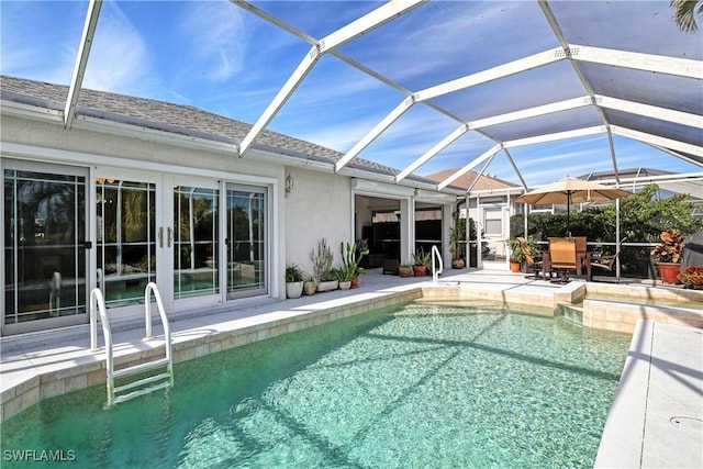 view of pool featuring a lanai and a patio area