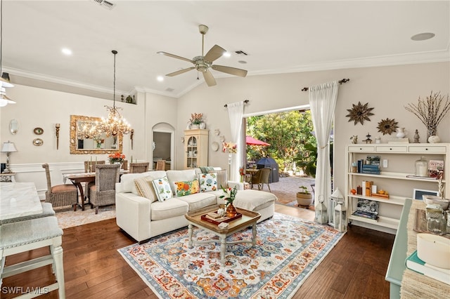 living room with crown molding, vaulted ceiling, and dark hardwood / wood-style floors