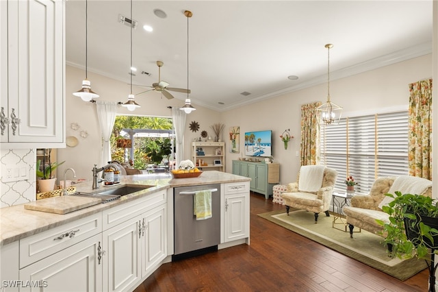 kitchen featuring hanging light fixtures, white cabinetry, ornamental molding, and stainless steel dishwasher