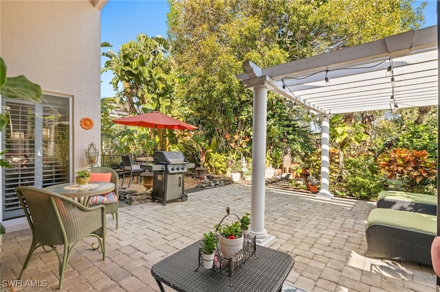 view of patio featuring grilling area and a pergola