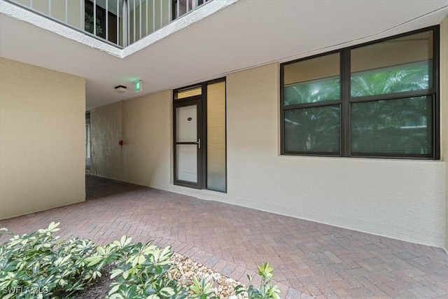 property entrance with a patio