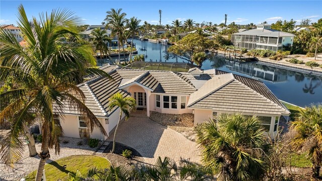 birds eye view of property with a water view