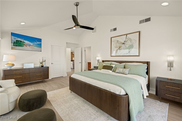 bedroom with light hardwood / wood-style flooring, high vaulted ceiling, and ceiling fan