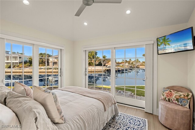 bedroom with ceiling fan, light hardwood / wood-style flooring, and access to outside