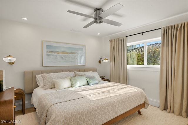 bedroom featuring light hardwood / wood-style flooring and ceiling fan