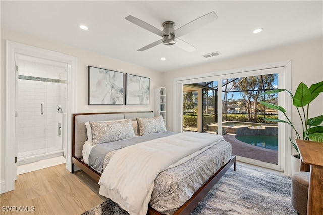 bedroom featuring ceiling fan, ensuite bathroom, access to exterior, and light hardwood / wood-style flooring