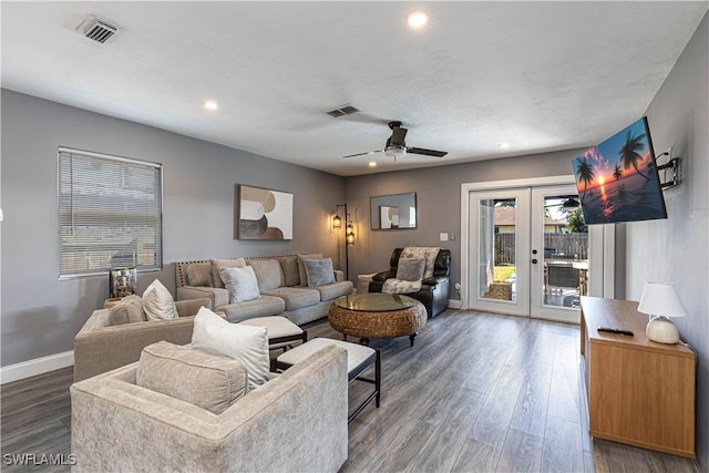 living room featuring dark wood-type flooring, ceiling fan, and french doors