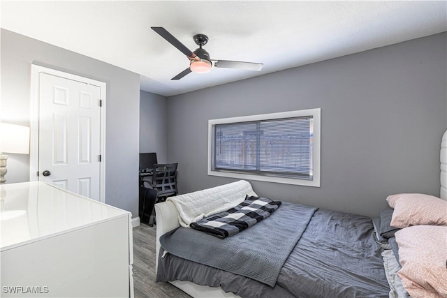 bedroom featuring wood-type flooring and ceiling fan