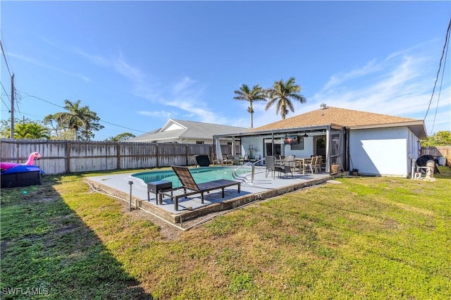 view of pool featuring a patio and a lawn