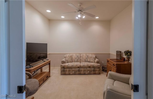 living room with carpet floors and ceiling fan