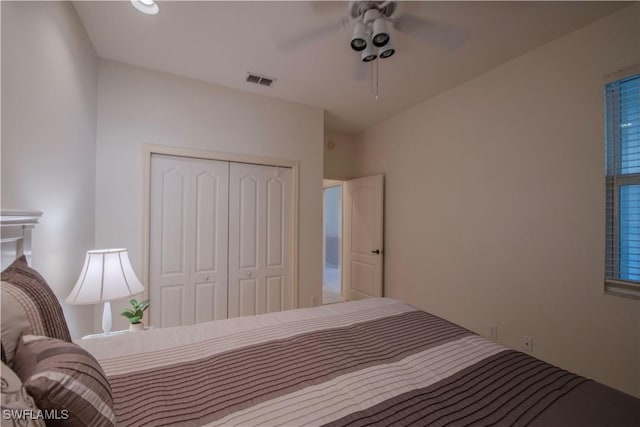 bedroom with ceiling fan and a closet