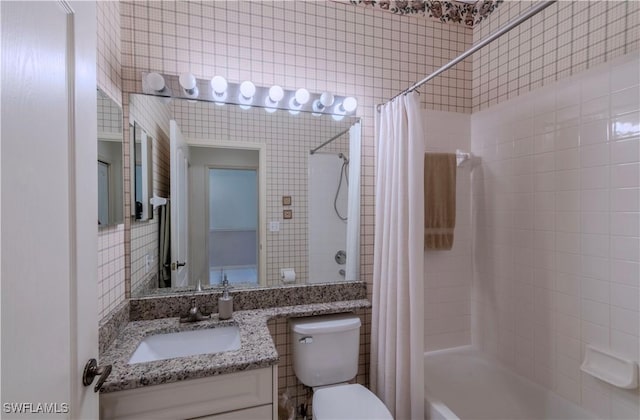 full bathroom with shower / bathtub combination with curtain, vanity, tile walls, and toilet