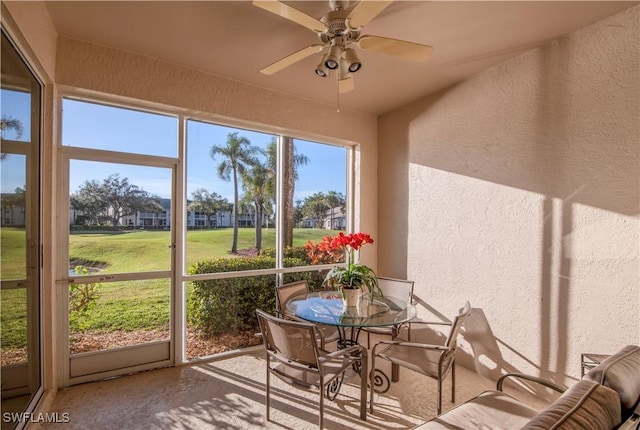 sunroom / solarium with ceiling fan