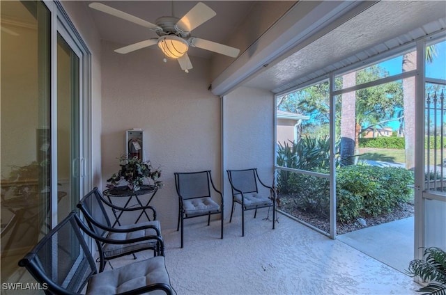 sunroom / solarium with ceiling fan