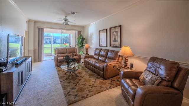 carpeted living room featuring crown molding and ceiling fan