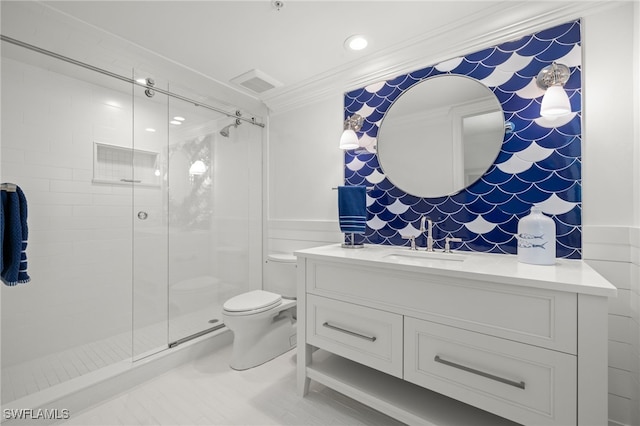 bathroom featuring walk in shower, ornamental molding, toilet, and vanity