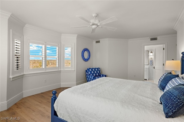 bedroom featuring hardwood / wood-style floors, crown molding, ceiling fan, and ensuite bathroom