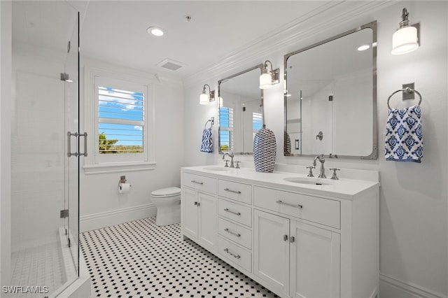 bathroom with crown molding, vanity, toilet, and an enclosed shower