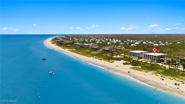 birds eye view of property featuring a view of the beach and a water view