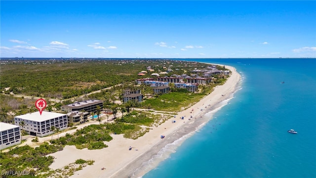 bird's eye view with a water view and a beach view