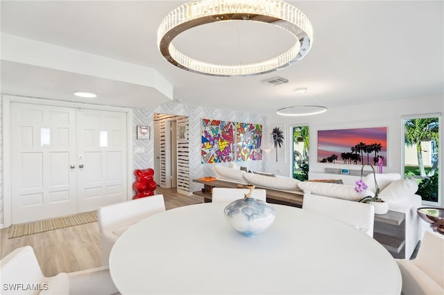 dining space with hardwood / wood-style floors