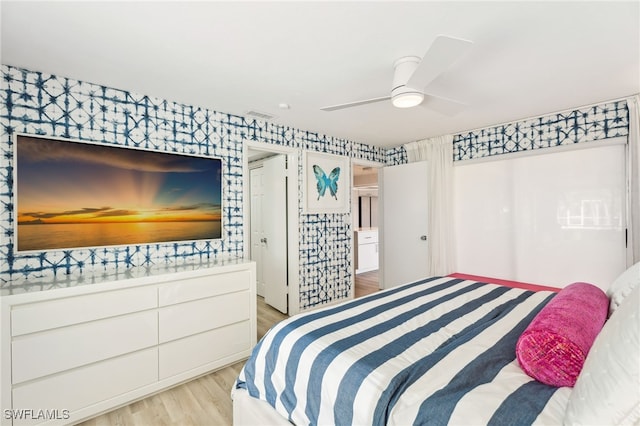 bedroom with ceiling fan and light hardwood / wood-style floors