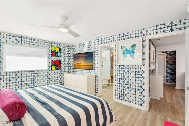 bedroom featuring light hardwood / wood-style flooring and ceiling fan