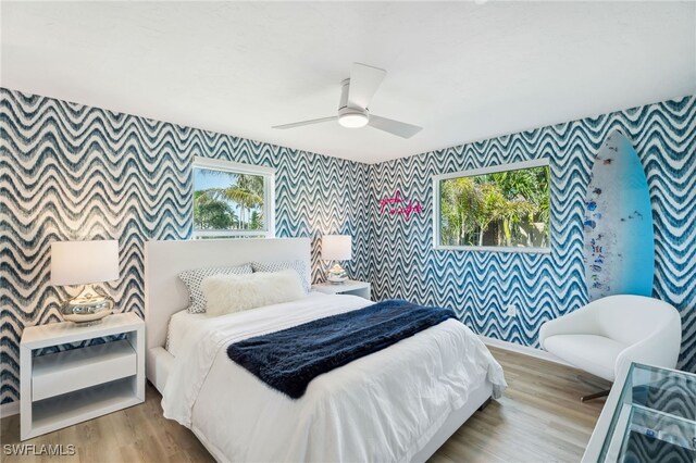 bedroom featuring ceiling fan and light hardwood / wood-style floors