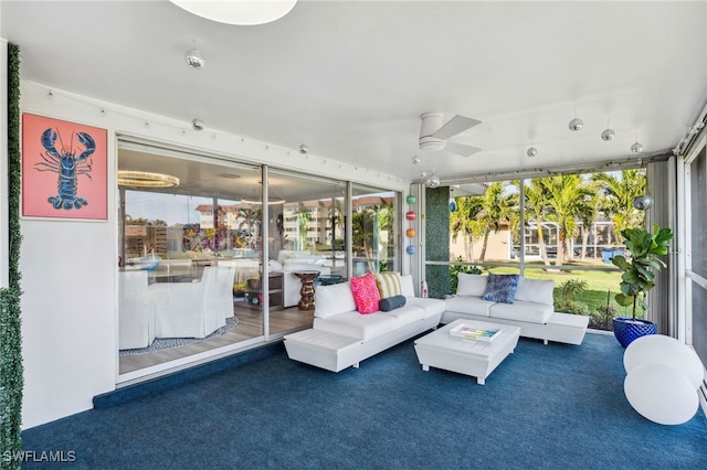 sunroom / solarium with ceiling fan