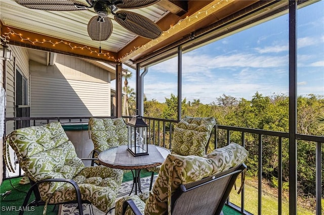 sunroom / solarium with ceiling fan