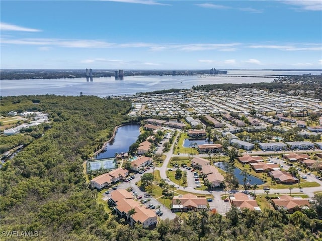 bird's eye view with a water view and a residential view