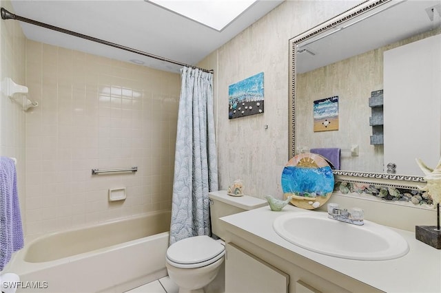 full bath featuring shower / tub combo, vanity, and toilet