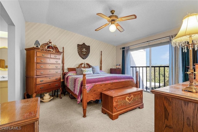 bedroom featuring light carpet, wallpapered walls, a ceiling fan, access to outside, and a textured ceiling