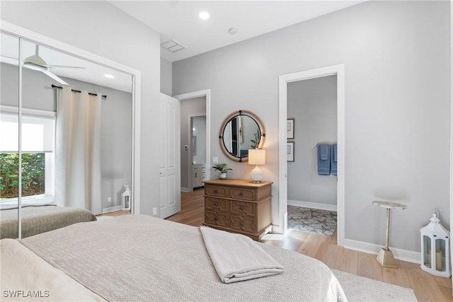 bedroom featuring light hardwood / wood-style floors and a closet