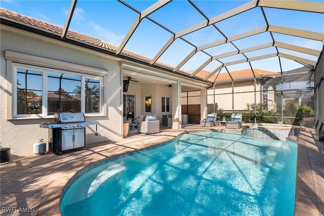 view of pool with an in ground hot tub, area for grilling, a lanai, and a patio area