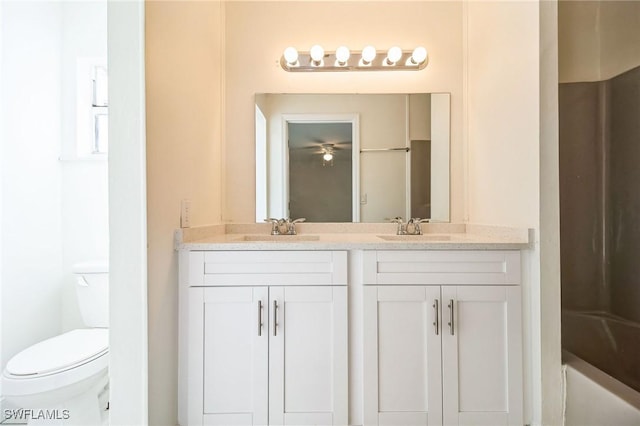 full bathroom with vanity,  shower combination, and toilet