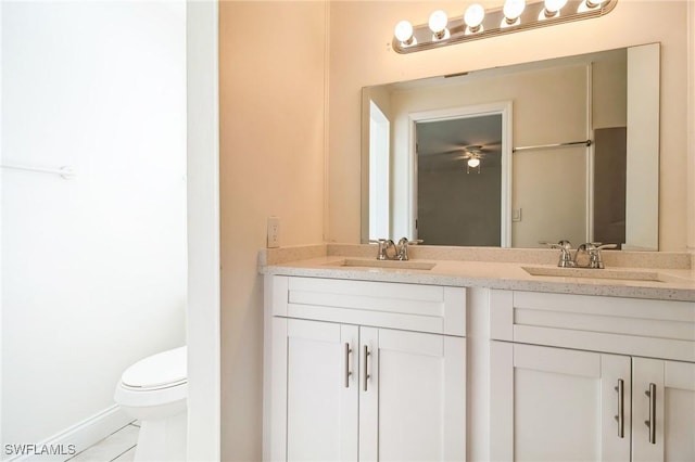 bathroom featuring vanity and toilet