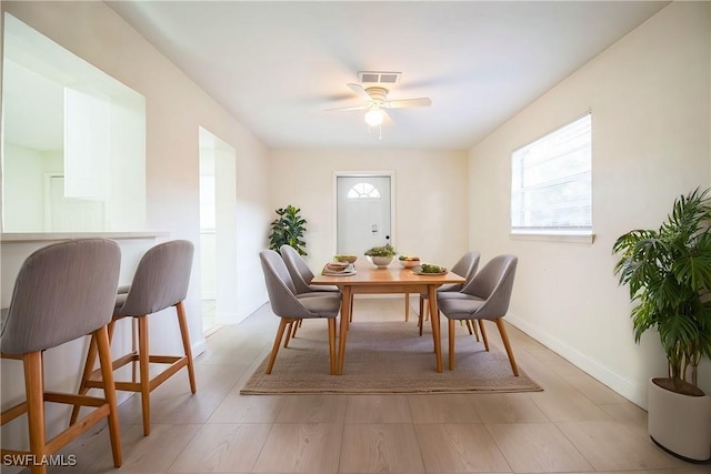 dining space featuring ceiling fan