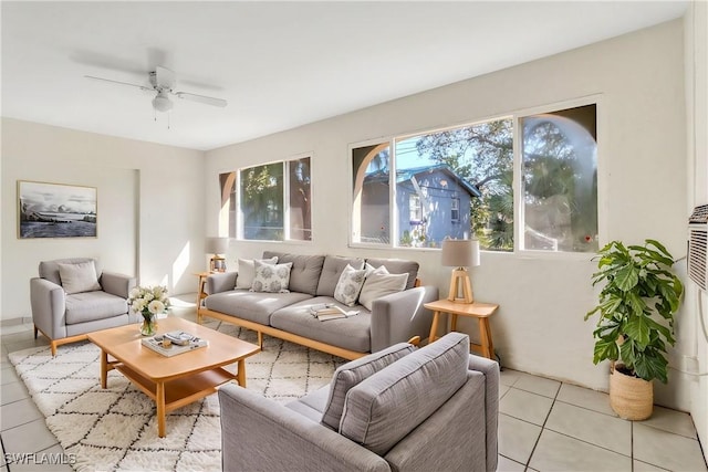 tiled living room with ceiling fan