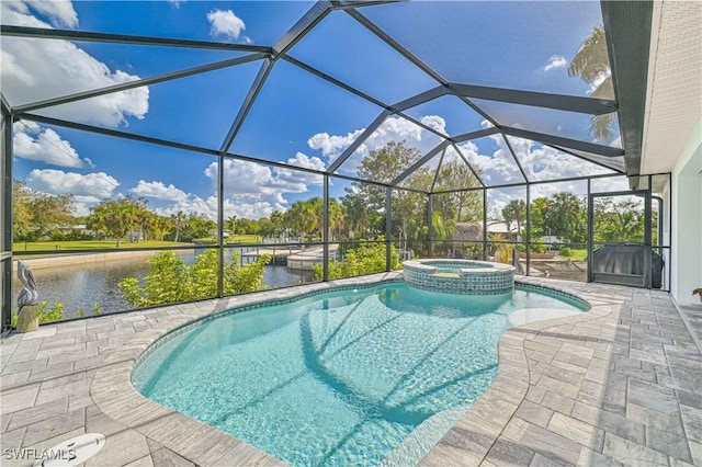 view of pool with an in ground hot tub, a water view, a lanai, and a patio area