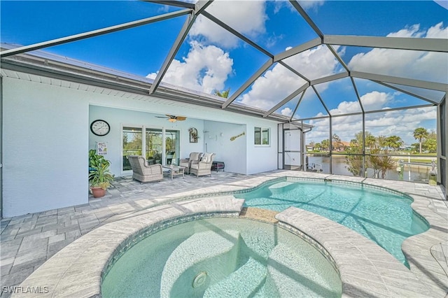 view of swimming pool with a lanai, outdoor lounge area, a patio, a water view, and an in ground hot tub