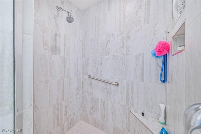 bathroom with a tile shower