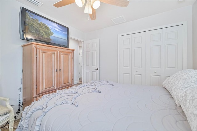 bedroom featuring ceiling fan and a closet