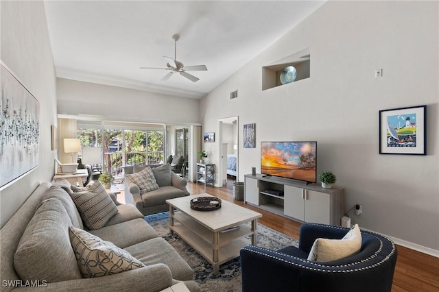 living room featuring hardwood / wood-style floors, high vaulted ceiling, and ceiling fan