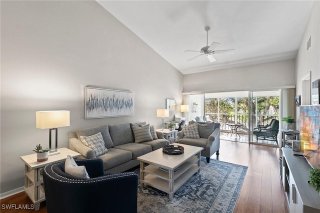 living room featuring ceiling fan, high vaulted ceiling, and dark hardwood / wood-style flooring