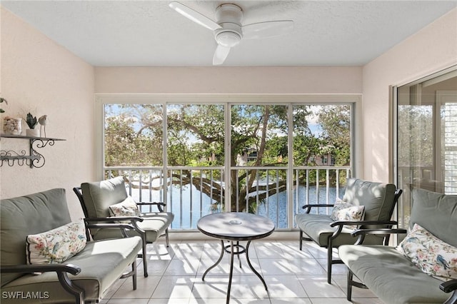 sunroom with ceiling fan