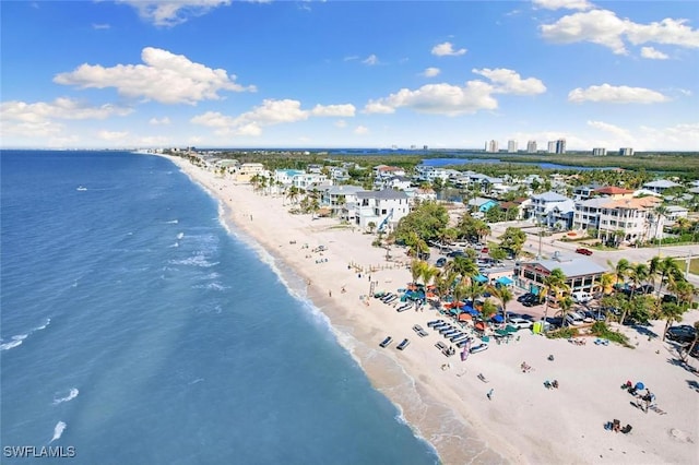 bird's eye view with a water view and a view of the beach